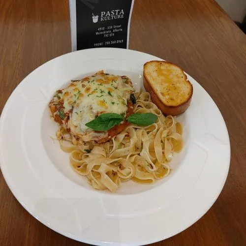 Chicken Parmesan — crispy breaded chicken with fresh pasta at Pasta Kulture Camrose Wetaskiwin Alberta